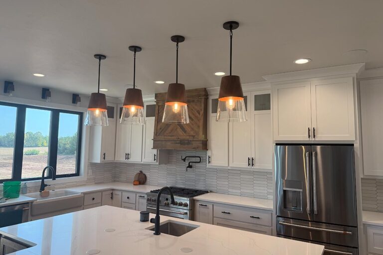 Installed lighting fixtures in a residential kitchen.